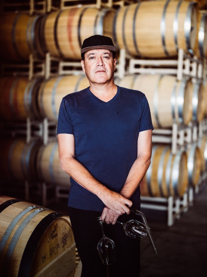 Vineyard manager Lucas Pope smiling in the barrel room